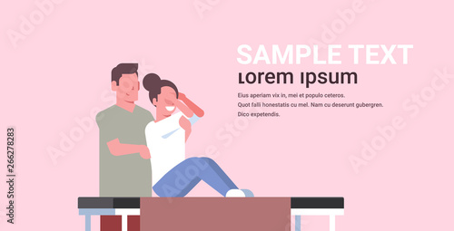 young woman sitting on table girl having back massage professional masseur massaging patient body luxury spa salon treatments concept horizontal copy space