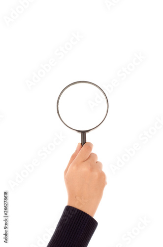 Hand holding magnifying glass isolated on white background