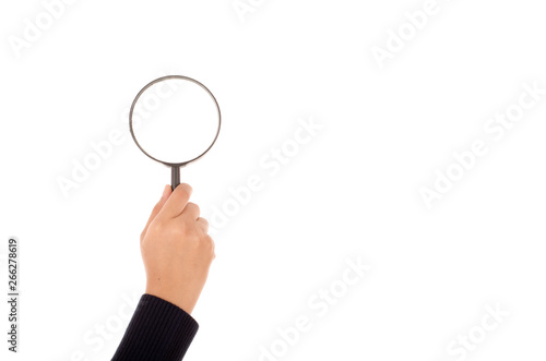 Hand holding magnifying glass isolated on white background