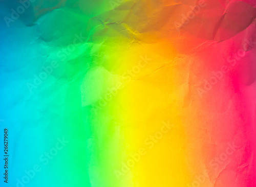 Multicolored paper background with yellow red blue and green