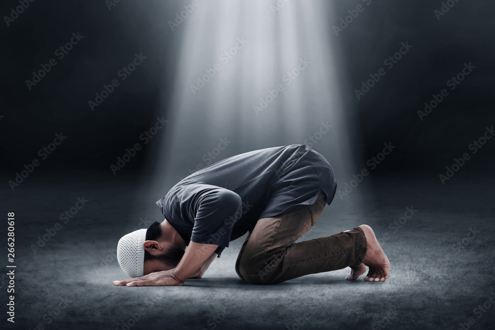 Religious asian muslim man praying Stock Photo | Adobe Stock