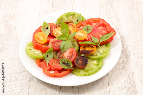 tomato salad with sauce and basil