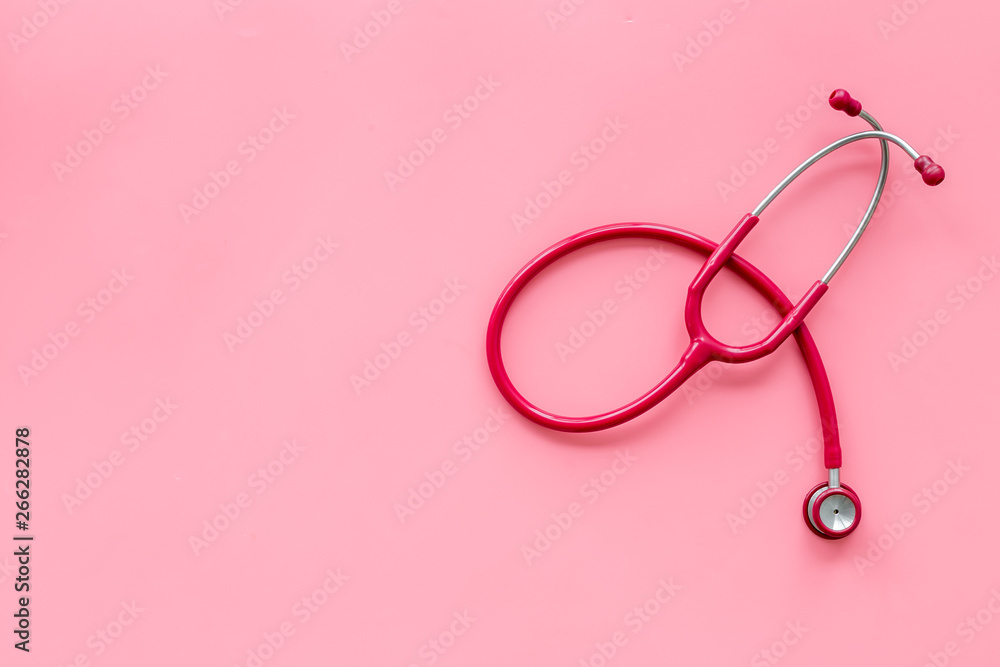 Fototapeta premium Stethoscope for family doctor set on pink background top view space for text
