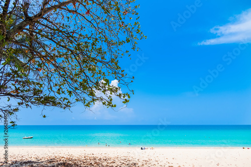 Fototapeta Naklejka Na Ścianę i Meble -  Summer seascape on tropical Phuket island in Thailand. Landscape taken on main long sunrise beach with blue sky and white sand.