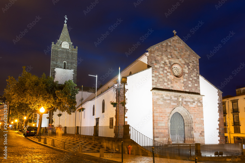 Beautiful cityscape of the Cathedral of Our Lady of the Assumption (Portuguese, e Catedral de Nossa Senhora da Assuncao) in Se, Funchal, Madeira, Portugal, at night in the blue hour