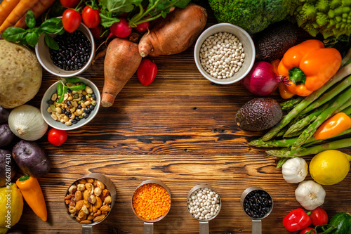 Assortment of fresh vegetables on wooden background