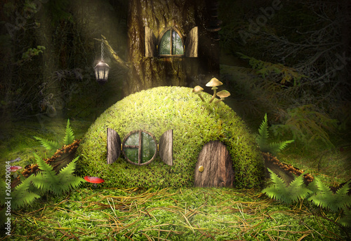 A small green house in the woods near a tree with a round window with a fern and mushrooms.