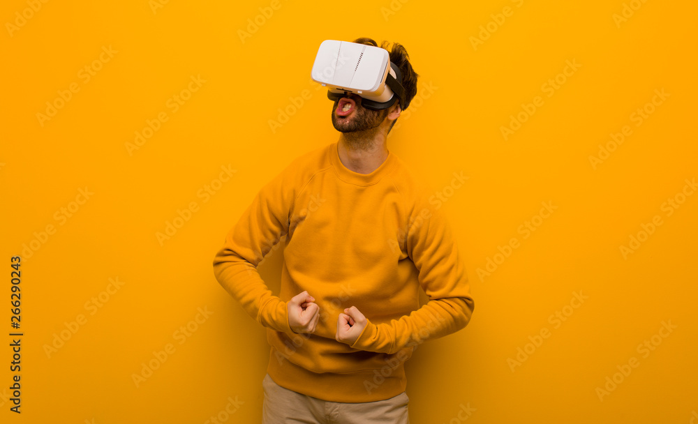 Young man wearing a virtual reality glasses