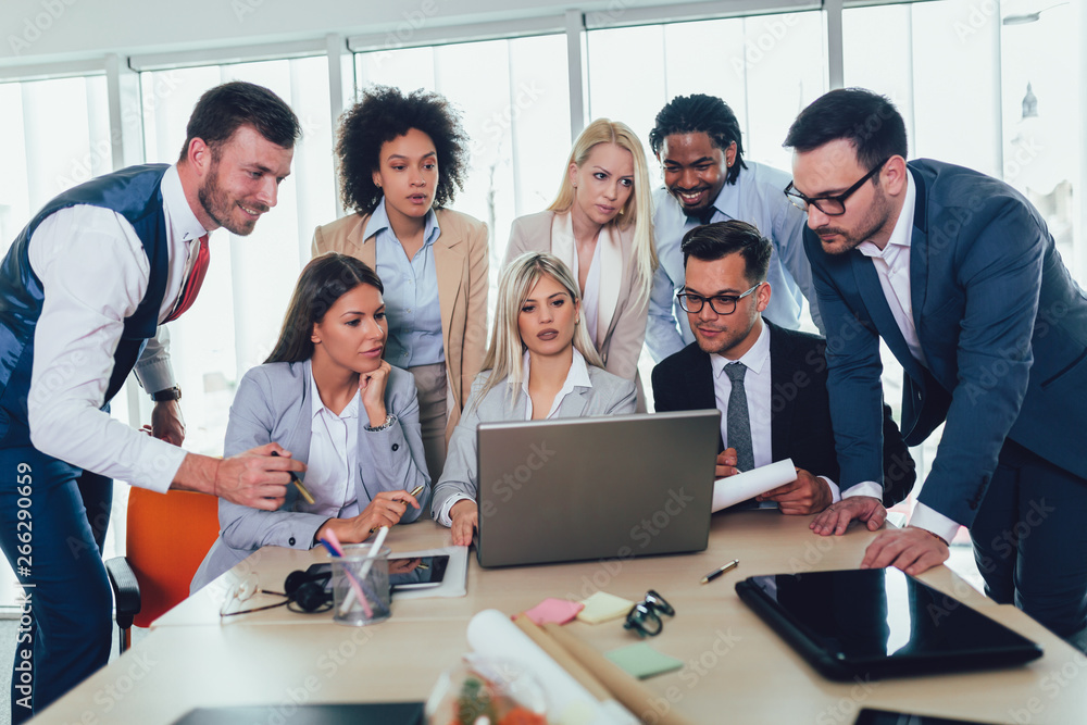 Group of young business people working together in creative office. Selective focus. Group of young business people working together in creative office. Selective focus.