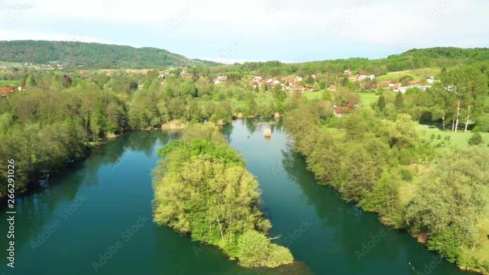 Croatia, green countryside, Mreznica river from air, panoramic view of Belavici village, waterfalls in spring, popular tourist destination Croatia, green countryside, Mreznica river from air, panoramic view of Belavici village, waterfalls in spring, popular tourist destination