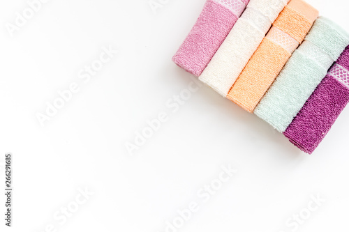 Bath accessories made of cotton set with towels on white background top view mockup