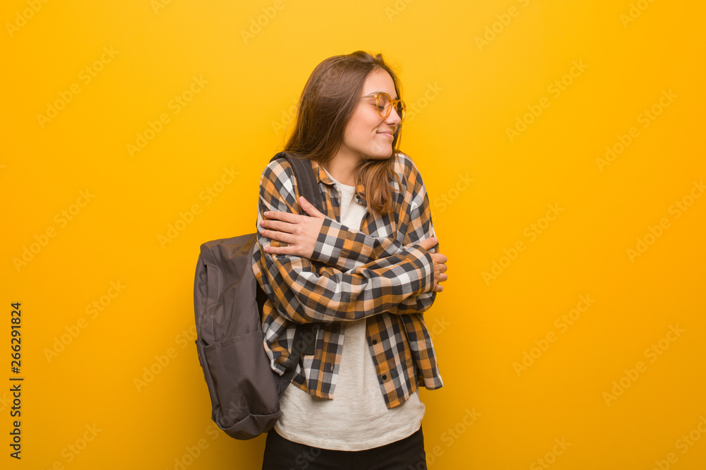 Young student woman giving a hug