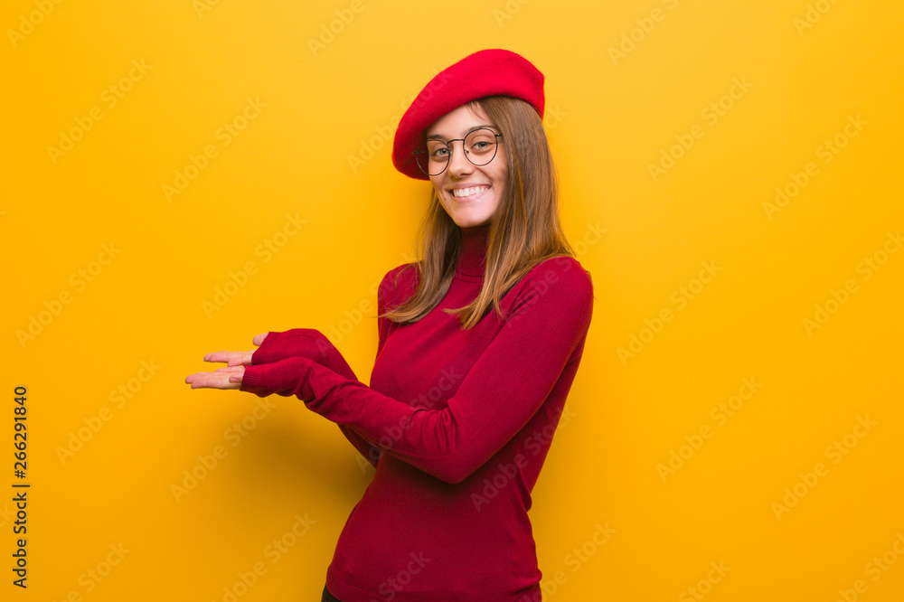 Young french artist woman holding something with hands Young french artist woman holding something with hands