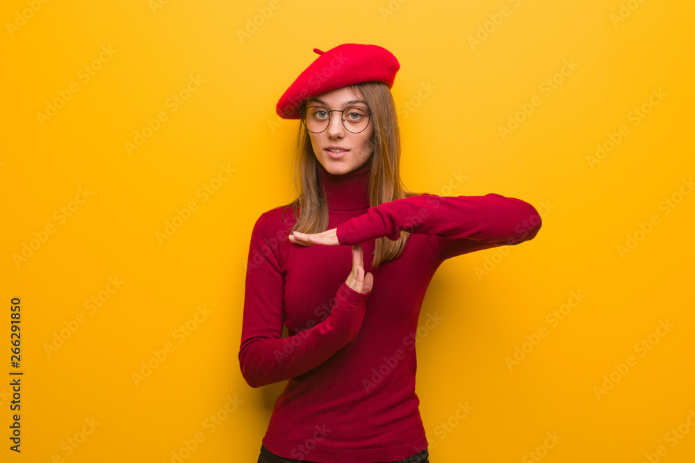 Young french artist woman doing a timeout gesture Young french artist woman doing a timeout gesture