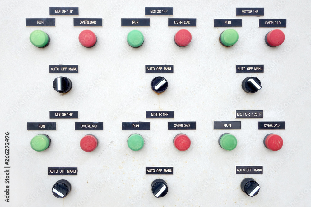 electric control switch with labels on panel board of white metal