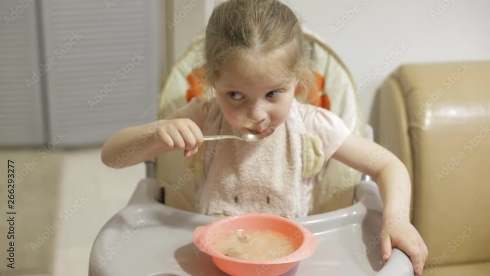 little girl eating soup little girl eating soup