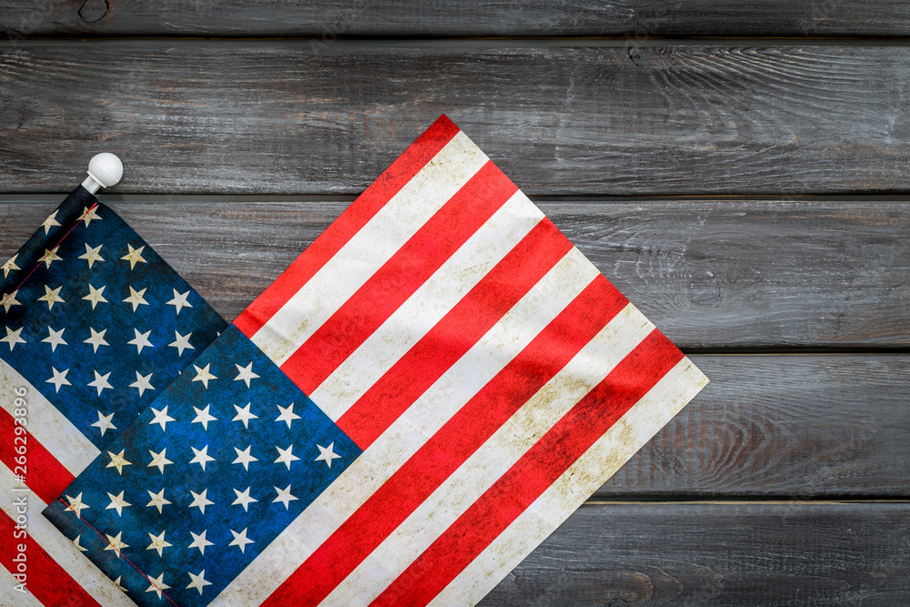 Obraz premium Memoral day of United States of America with flag on gray wooden background top view