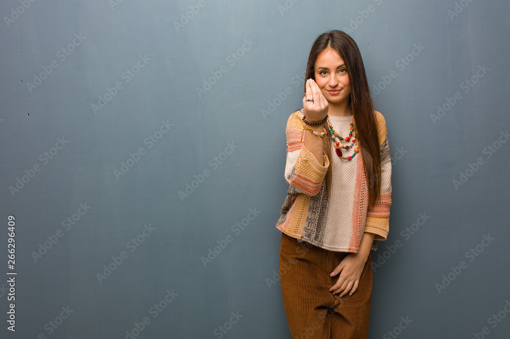 Young hippie woman doing a typical italian gesture Young hippie woman doing a typical italian gesture