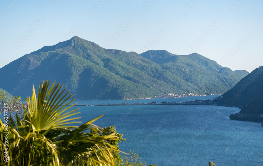 lake in mountains. Mt. San Giorgio and Melide.