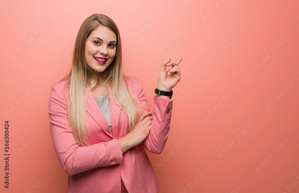 Young russian woman wearing pajama pointing to the side with finger Young russian woman wearing pajama pointing to the side with finger