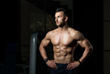 Muscular Bodybuilder Flexing Muscles