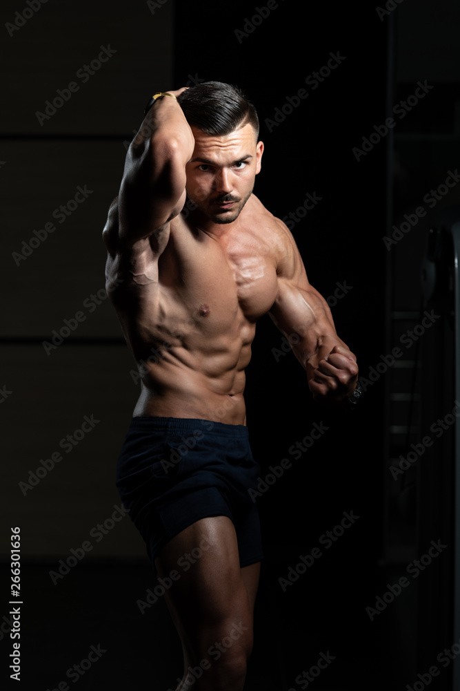 Young Bodybuilder Flexing Muscles Side Chest Pose Young Bodybuilder Flexing Muscles Side Chest Pose