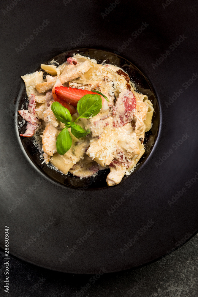 Italian penne pasta with cheese and basil