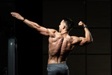 Young Bodybuilder Flexing Back Pose