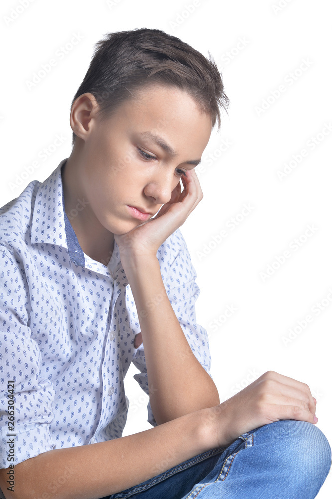 Portrait of sad teenage boy isolated on white background Portrait of sad teenage boy isolated on white background