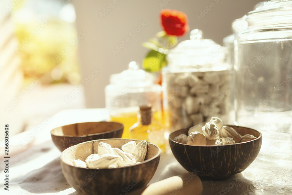 White clay filler or soft prepared chalk or clay rich in coconut shell bowls. Old traditional spa in Thailand. White clay filler or soft prepared chalk or clay rich in coconut shell bowls. Old traditional spa in Thailand.