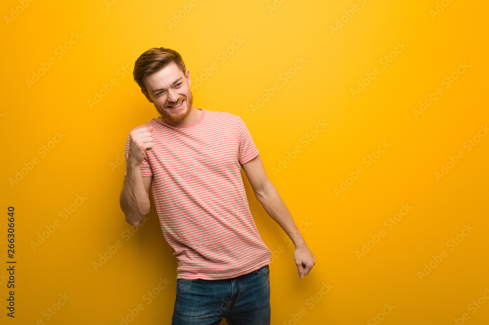 Young redhead man dancing and having fun Young redhead man dancing and having fun