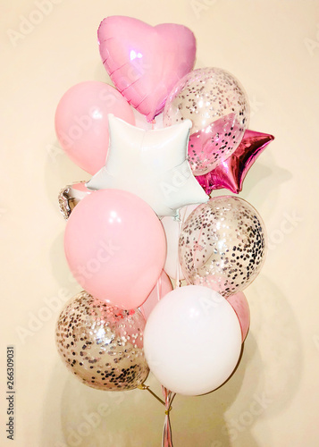 Composition of helium balloons white and pink, balloons with silver confeety as well as a silver and white, white, fuchsia stars