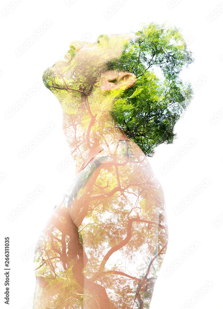 Double exposure of a young bare-chested man’s portrait blended with bright green leaves, showing the perfect beauty of nature's creation - obrazy, fototapety, plakaty 