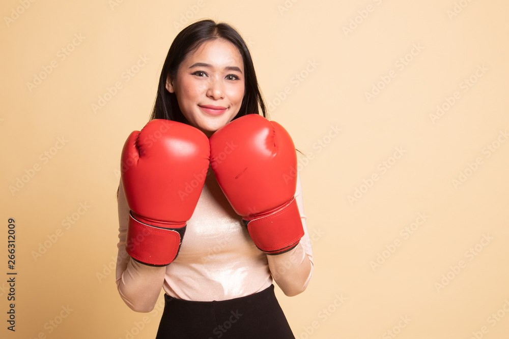 Young Asian woman with red boxing gloves. Young Asian woman with red boxing gloves.