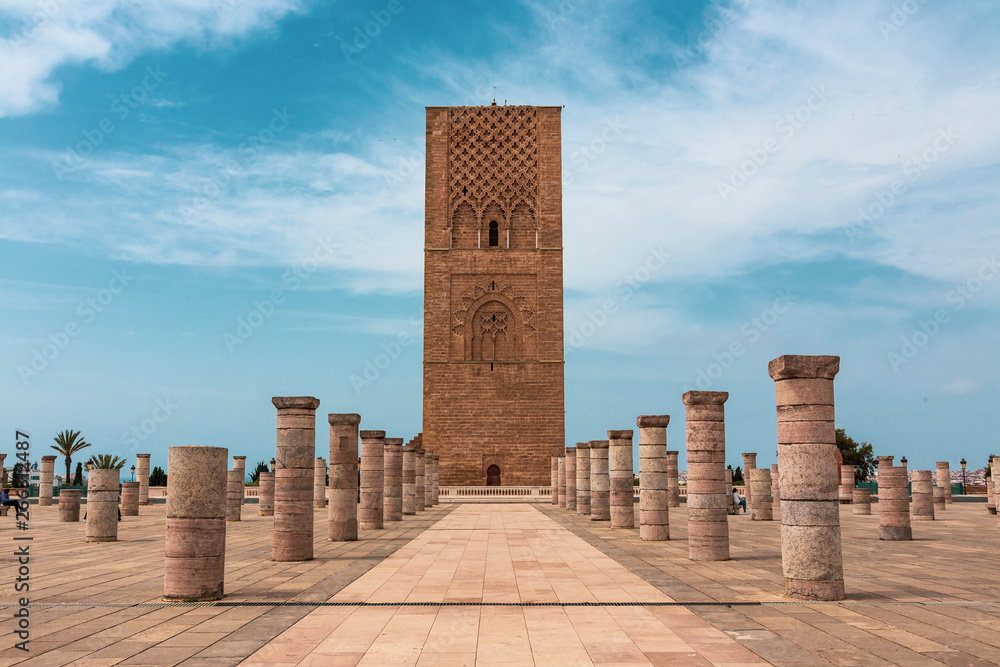 Tour Hassan tower in the square with stone columns. Made of red sandstone, important historical and tourist complex in Rabat, Morocco