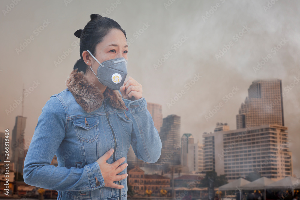 Plakat Women wearing facial hygienic mask for Safety outdoor. People in masks because of fine dust in thailand. Problems found in major cities around the world. air pollution,Environmental awareness concept