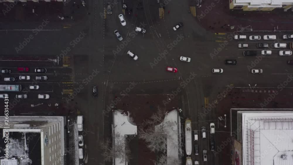 Aerial view of a busy intersection with dense traffic during heavy snowfall. Aerial view of a busy intersection with dense traffic during heavy snowfall.