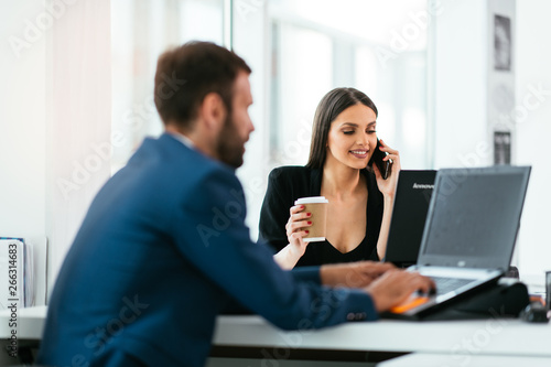 Colleagues working together, having coffee. Managers at the meeting. Colleagues getting ready for conference.