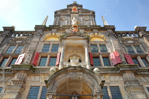 Wide angle on the external facade of the Town Hall (rebuilt in 1629) in Delft, Netherlands, with carvings