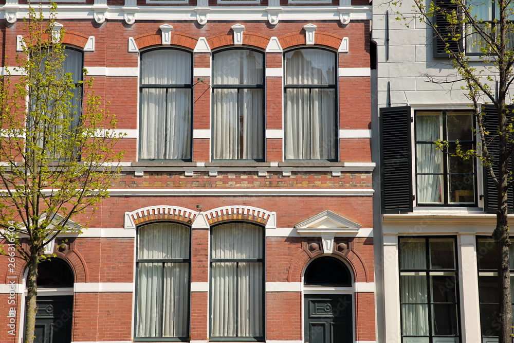 Historical facades with carvings located along Oude Delft Canal, Delft, Netherlands