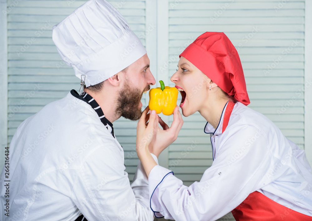 Love is in the air. happy couple in love with healthy food. Family cooking in kitchen. vegetarian. cook uniform. Dieting and vitamin. culinary cuisine. man and woman chef in restaurant Love is in the air. happy couple in love with healthy food. Family cooking in kitchen. vegetarian. cook uniform. Dieting and vitamin. culinary cuisine. man and woman chef in restaurant