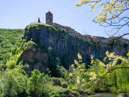 Castellfullit de la Roca town situated over the 50 meters basalt crag in Catalonia, Spain photo