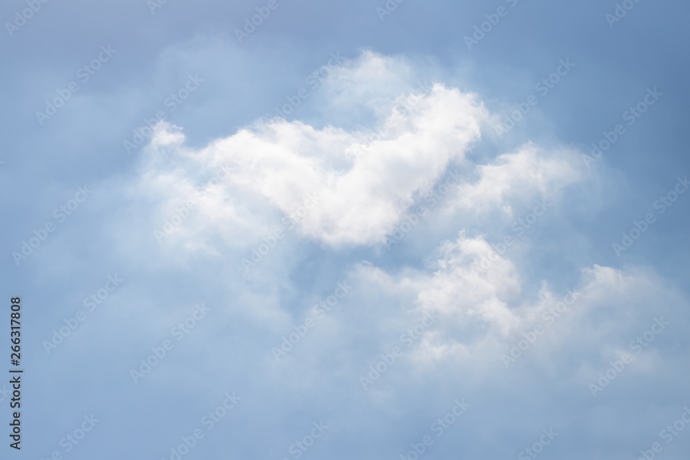 Naklejka premium white cloud background and texture on blue sky. strange cloud shape.