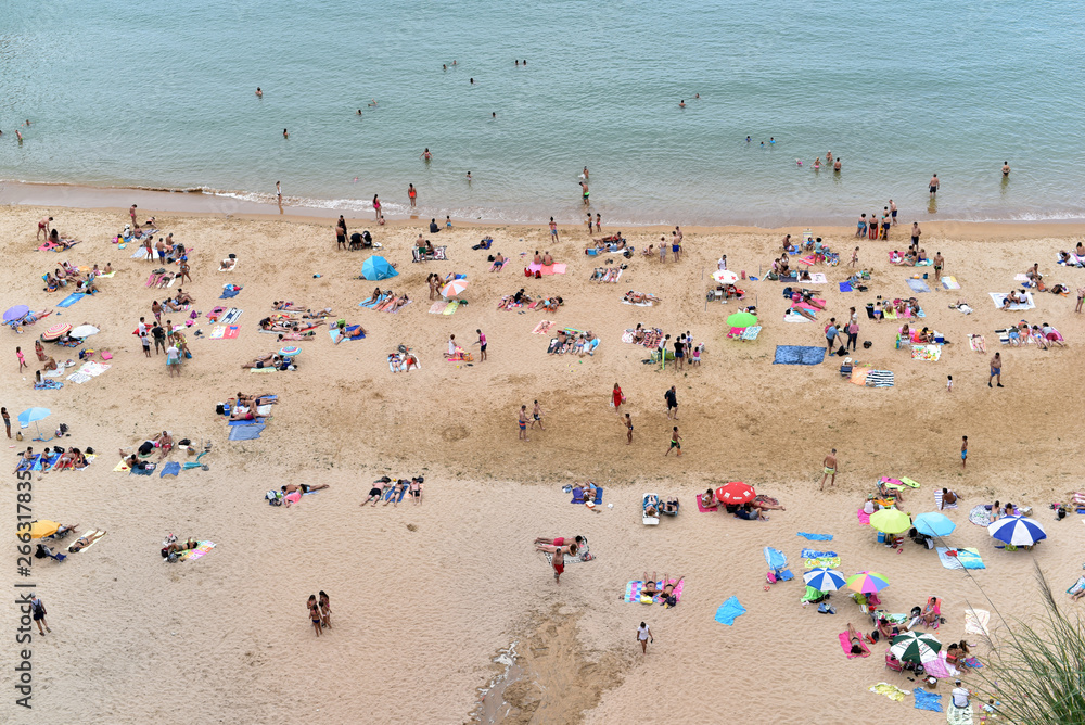 People on the beach of Playa de Matalenas, Cantabria, Santander, Spain People on the beach of Playa de Matalenas, Cantabria, Santander, Spain