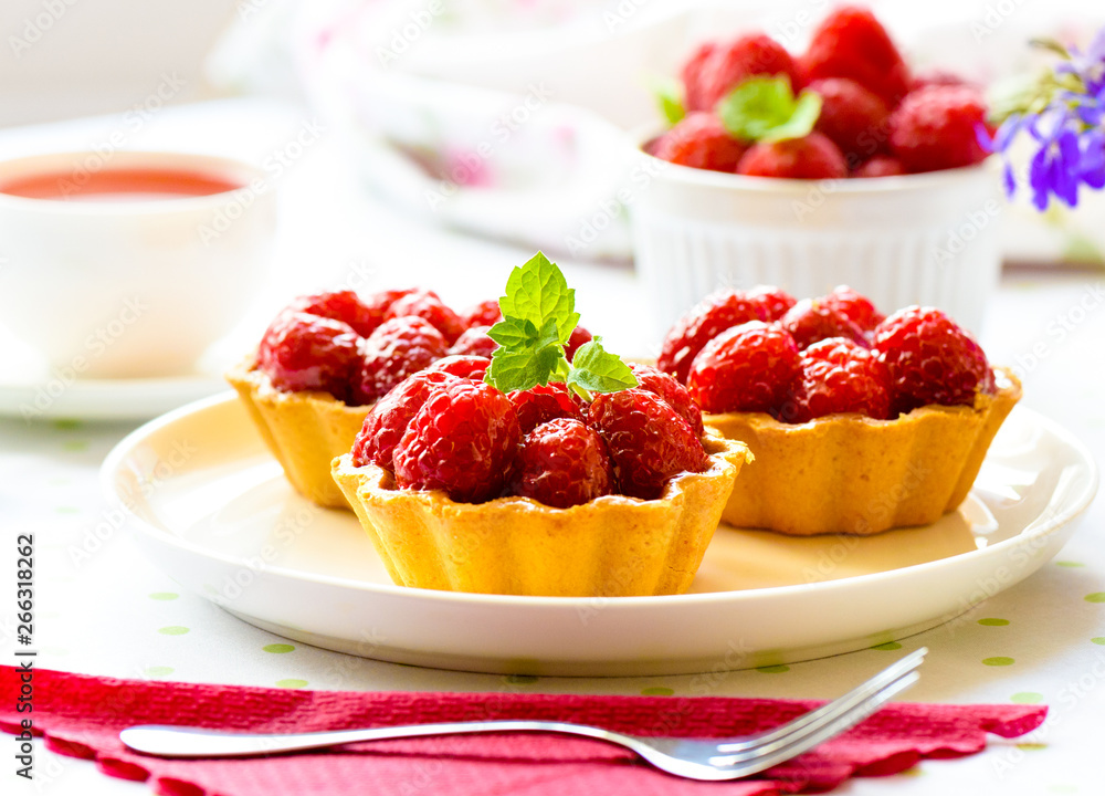 Fruit raspberry cakes on a table Fruit raspberry cakes on a table