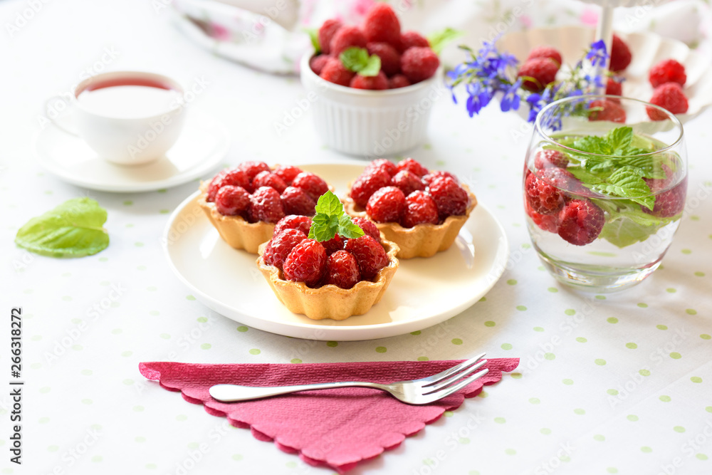 Fruit raspberry cakes on a table Fruit raspberry cakes on a table