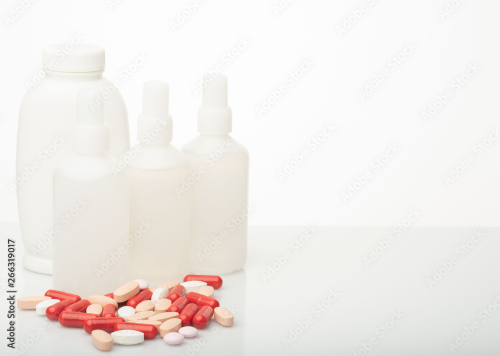 medical red and white pills and capsules with medicine are on a white background medical red and white pills and capsules with medicine are on a white background