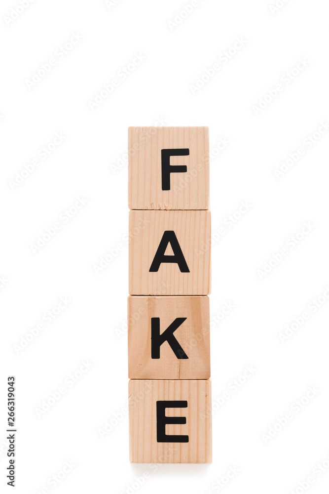 fake lettering made of wooden cubes isolated on white fake lettering made of wooden cubes isolated on white