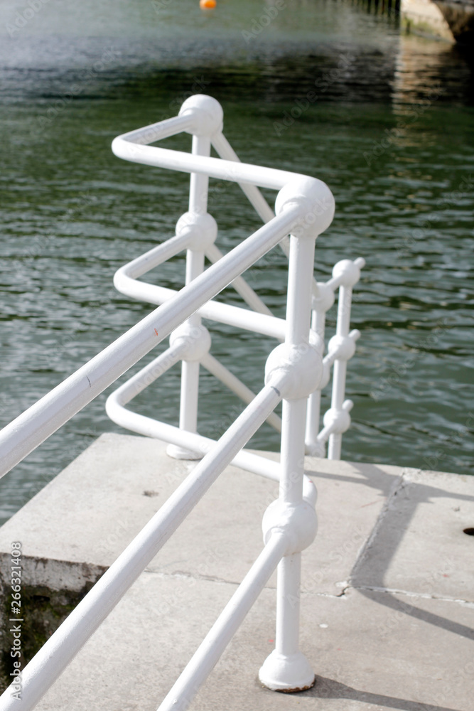 White railing at the riverside White railing at the riverside