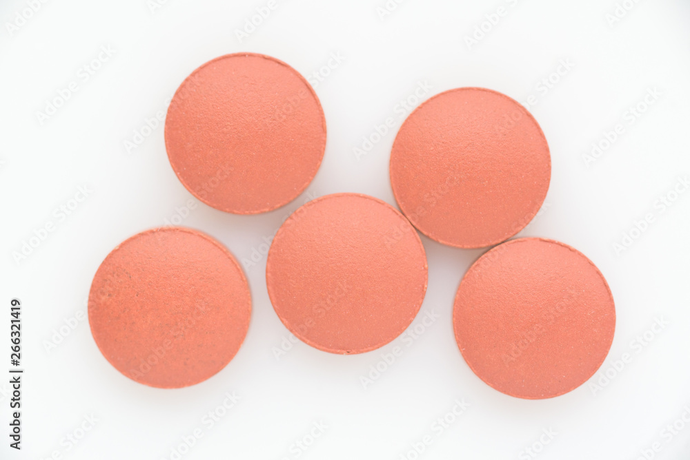 Pills on a light background close up. View from above. Pills on a light background close up. View from above.